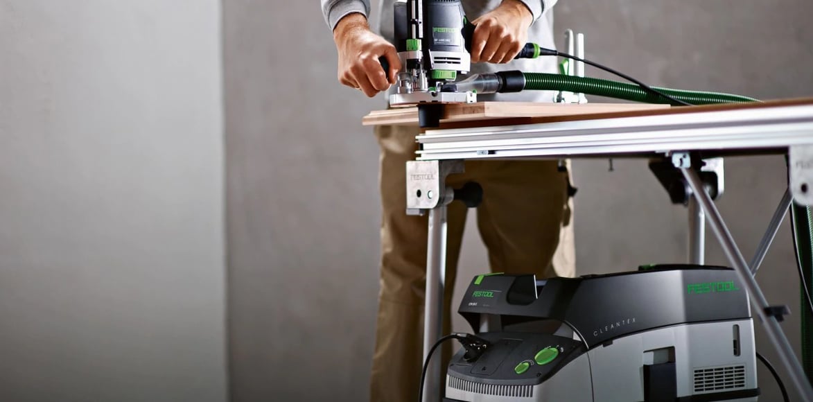 craftsman using Festool dust extractor