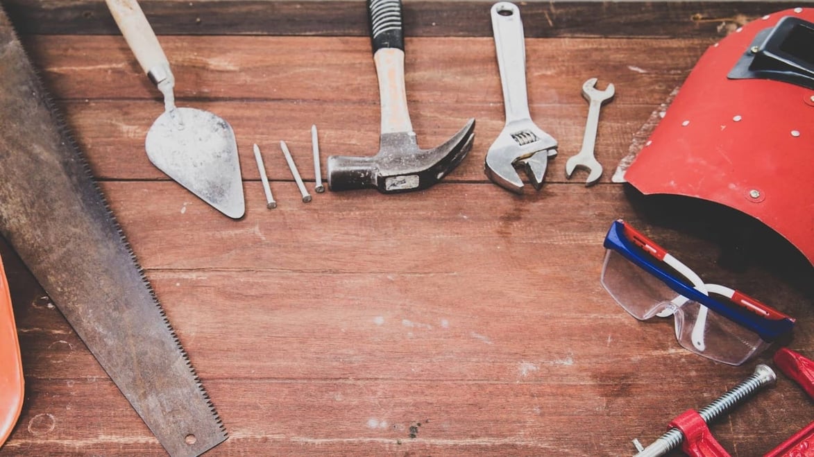 wooden table with various tools